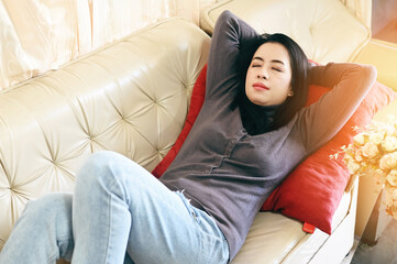 sleeping on the sofa woman relaxing sleeping on couch at home, relaxed serene pretty young woman feel fatigue lounge on comfortable sofa rest at home, happy calm lady dream enjoy wellbeing take a rest