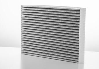 new carbon filter of the cabin of the car on a white background