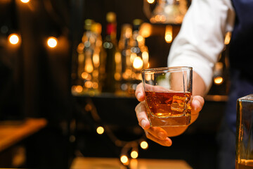Bartender pouring Whiskey, on  bar,