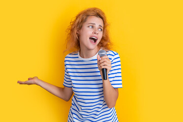 girl singer having fun isolated on yellow background. young singer girl sing in studio.