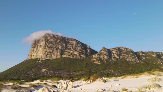 misty clouds forming on top of a rocky mountain near pringle bay, south africa