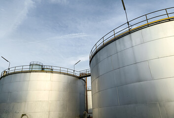 Oil storage tank In industrial areas. Crude oil storage plant For export. Palm oil factories in Asia. The atmosphere at sunset. With in the industrial plant. Zone tank storage industry. Power station  © Яe Life Яe World