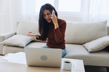 Obraz premium Woman talking on phone angry and sad at home, fight over phone, bad news