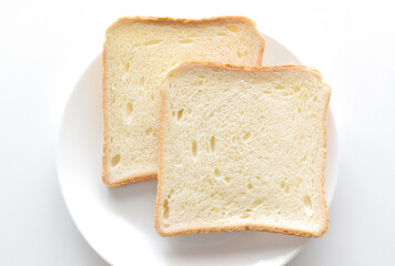 Sliced bread on a white plate. 