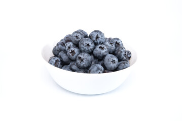 Blueberries in white bowl isolated on white background