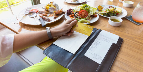 Money spent with credit card to pay expenses  food economic crisis concept. which  the food, to...