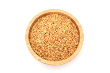 Top view of golden sesame seeds in wooden bowl isolated on white background