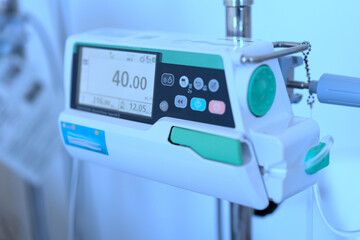automatic saline drip infused iv fluid in vein for treatment in hospital