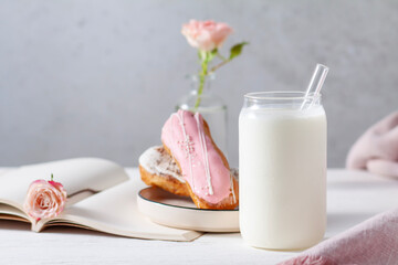 Cocktail in a transparent glass and dessert on the table