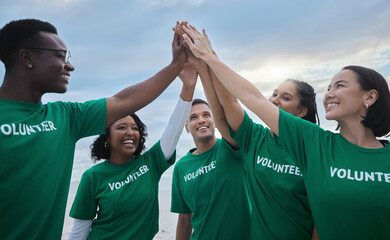 Teamwork, high five and volunteer with people on beach for sustainability, environment and climate...