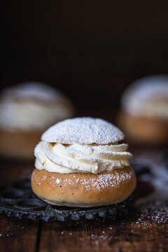 Swedish semla semmel bun on dark background.