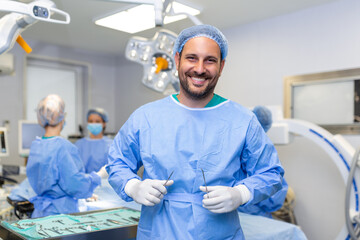 Portrait of male surgeon in operation theater looking at camera. Doctor in scrubs and medical mask in modern hospital operating room.