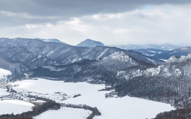 Obraz premium Snowy winter landscape with rocky mountain range. National Nature Reserve Sulov Rocks, Slovakia, Europe.