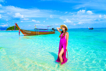 woman with a pink dress on the beach in krabi thailand, chicken island, tup island, photo shooting, model shooting
