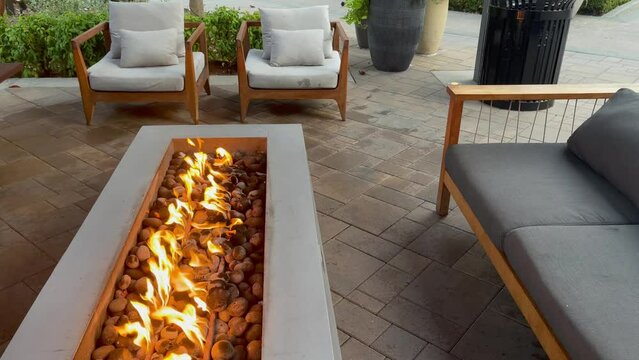 Fireplace Outdoor Patio With Sofa And Armchairs. Large Built-in Gas Fireplace. Perfect For Cool Fall Evenings