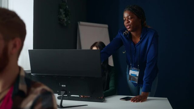 big data analytics department of company, multiethnic team of programmers, smiling black woman