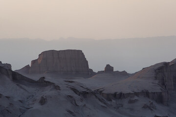 Peaceful view of the beautiful Dasht-e Lut Desert and its rock formations (Kaluts) at sunset, Kerman Province, Iran