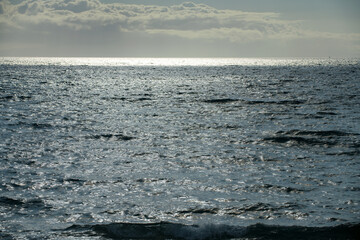 Tropical blue ocean in Hawaii. Summer sea in clean and clear water from surface for background. Waves concept design.