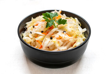 sour cabbage in wooden bowl pepper on white table Fermented vegetable concept Healthy food Top view