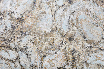 Abstract motley pattern in beige, brown and gray-blue tones with black striped splashes.