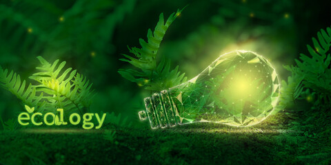 A symbolic glowing light bulb in the forest and the inscription Ecology. Green energy, renewable,...