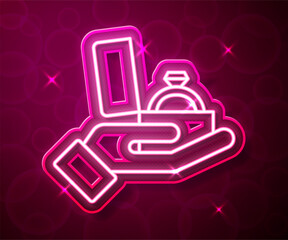 Glowing neon line Diamond engagement ring in a box icon isolated on red background. Vector