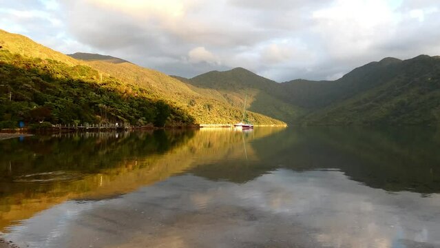 Incredible Early Morning Golden-hour Reflection Of Sea, Sky And Land From Secluded Cove - Camp Bay, Endeavour Inlet (New Zealand)