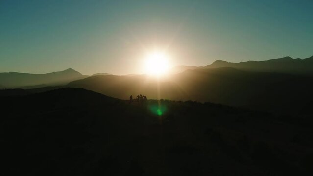 mountainbikes silhouette at sunrise in Atlas mountains