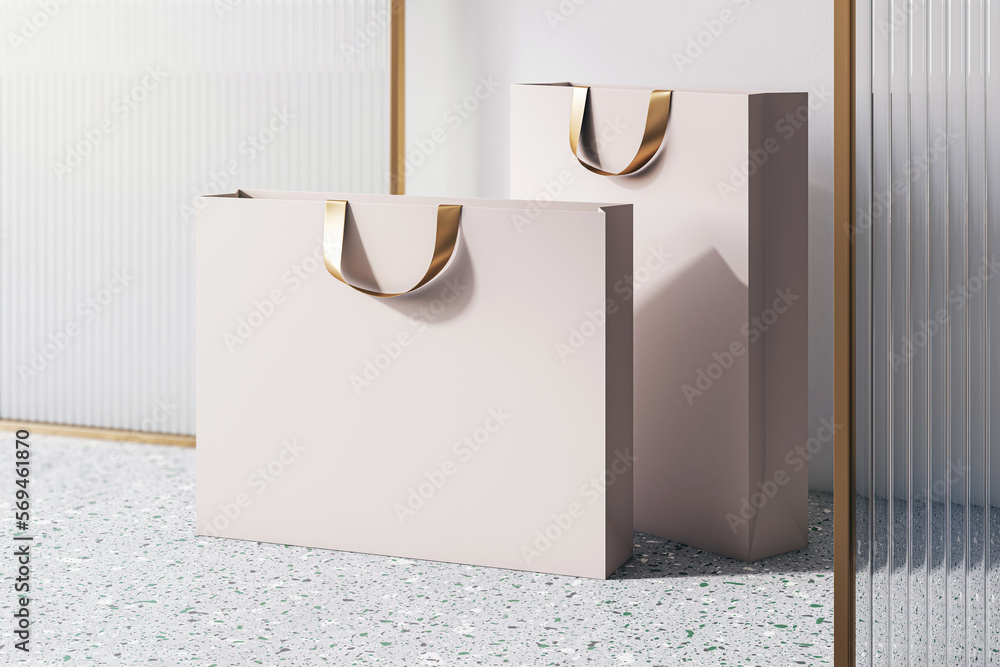 Poster perspective view on blank beige paper shopping bags with golden braids and space for your brand name