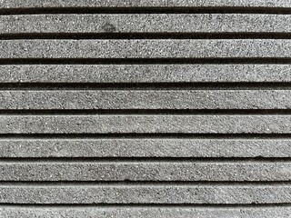 Background of striped stone construction with rough texture for house wall.