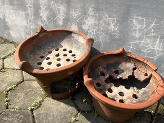 Traditional cooking utensil featuring stove made from clay for cooking with burning charcoal.