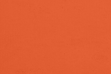Saturated pastel orange colored low contrast Concrete textured background. Empty colourful wall texture with copy space for text overlay and mockups. 2023, 2024 color trend
