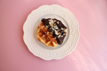 Round Chocolate Waffle on a white ceramic plate