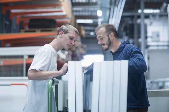 Store workers working in a distribution warehouse, Freiburg im Breisgau, Baden-W&uuml;rttemberg, Germany