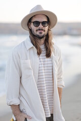 portrait of a man in a hat in varna bulgaria on the beach, model shooting , beach shooting 