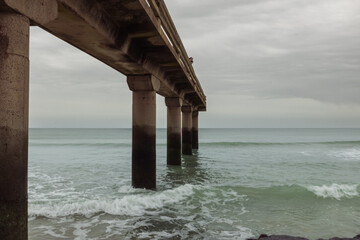 close-up view from the bottom of the bridge, from the water. Beautiful view of the ocean