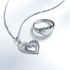 Elegant jewelry set. Jewellery set with gemstones. Jewelry accessories collage. Product still life concept. Ring, necklace and earrings.