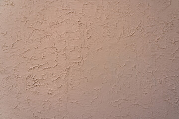 Rough textured wall surface, decorative plaster. Backdrop for design, graphic resource. Texture background.