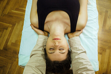 a CST treatment session for a woman, Osteopathic Manipulation and CranioSacral Therapy 7