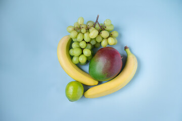 fruits and citrus in assortment on a blue background