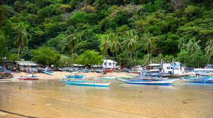 Fototapeta na wymiar Traditional Boats in the Bay of El Nido, Palawan, Philippines