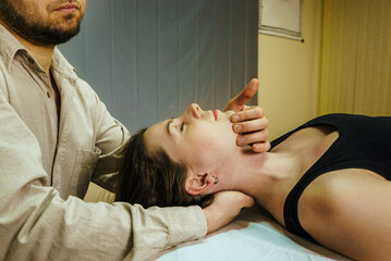 a CST treatment session for a woman, Osteopathic Manipulation and CranioSacral Therapy