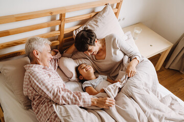 Happy mature same sex couple with adopted asian little girl