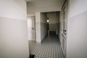 Entrance door and wardrobe in luxury apartment. Modern interior. Grey colors.