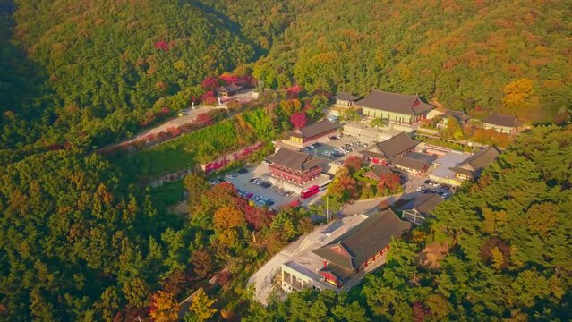 Aerial video of Gakwonsa temple during Autumn season in Cheonan city, South Korea. Aerial shot from drone.
