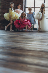 Fashion kids. Portrait of cute little kids in stylish clothes looking at the camera and smiling. Beautiful dress.