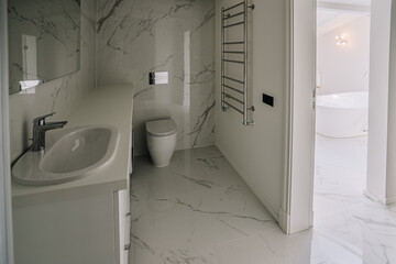 Interior of modern bathroom with toilet bowl