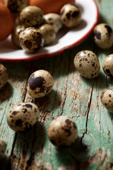 Quail eggs on a wooden table.