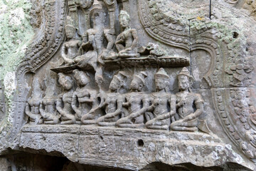 The stone carvings at Ta Prohm Temple. Is an abandoned Buddhist temple in a jungle. Angkor Wat. Cambodia