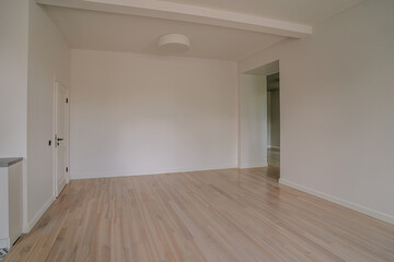 Obraz premium Classical empty room interior. The rooms have wooden floors and gray walls ,decorate with white moulding,there are white window looking out to the nature view.